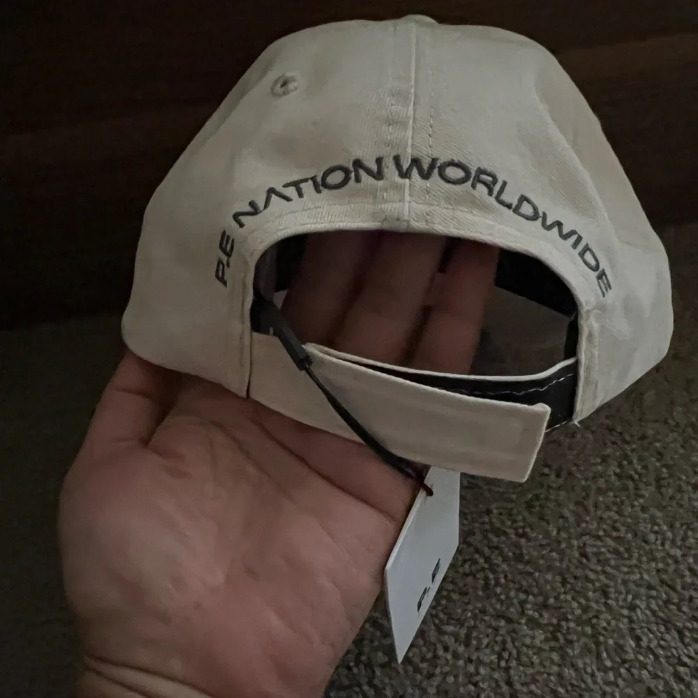 NWT P.E Nation Homage Cap Cream Hat